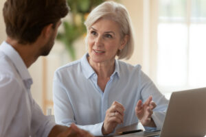 A woman talking intently to a man.