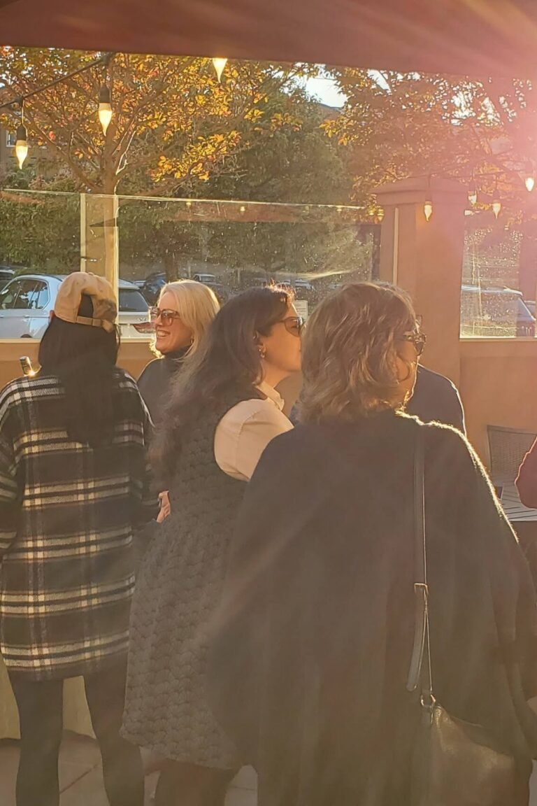 Seminar attendees gathering and talking during the reception.