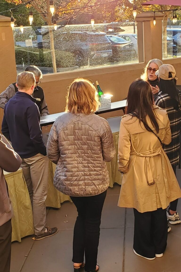 Seminar attendees and instructors having conversations during the reception.