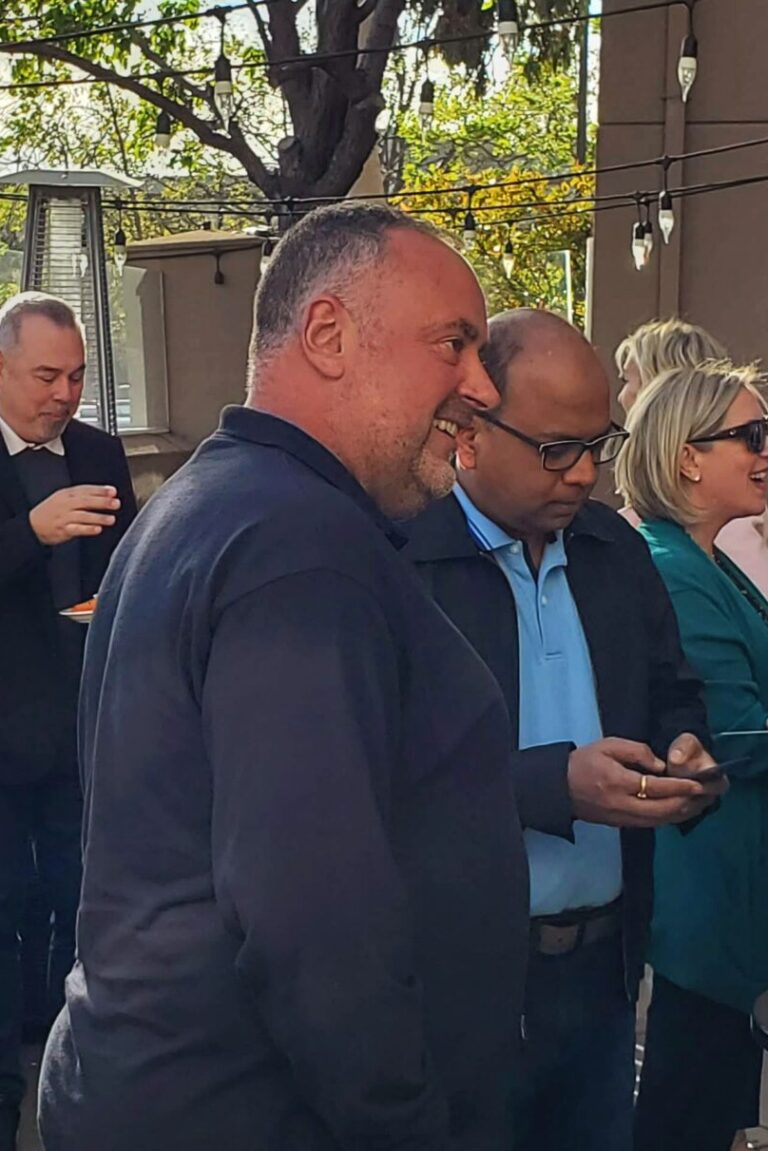 Seminar attendees chatting amicably at the reception.