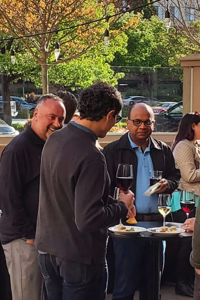 Seminar attendees enjoying wine at the reception.
