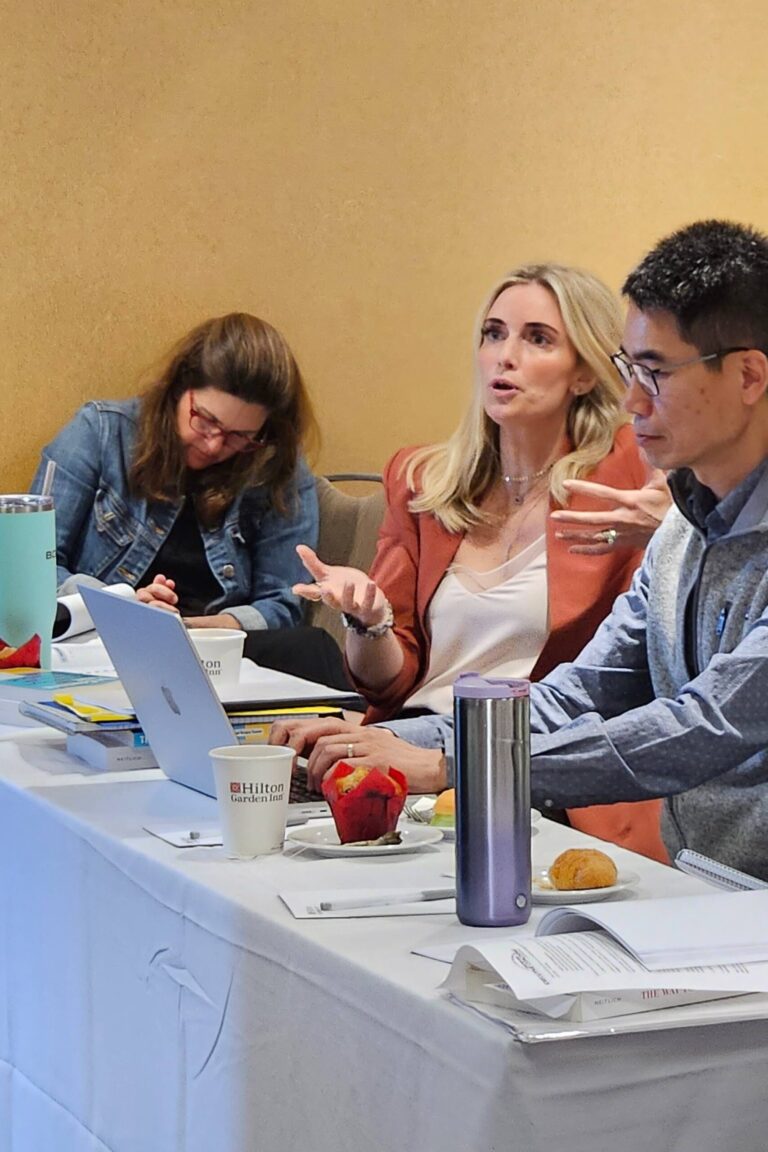 A seminar attendee asks a question.