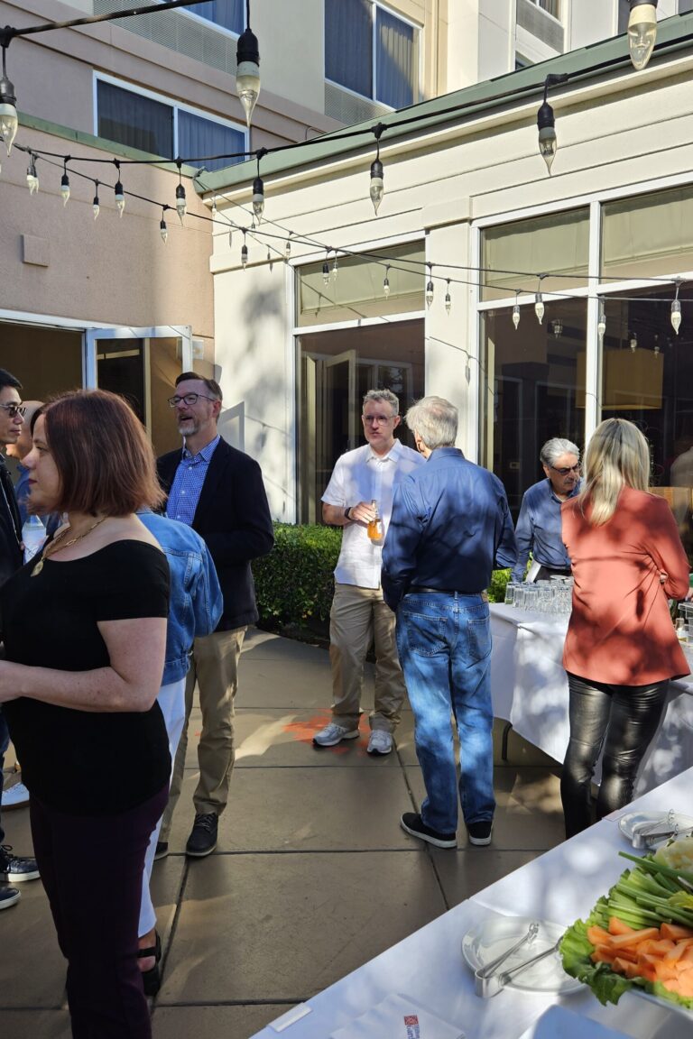 Seminar attendees chatting at the reception.
