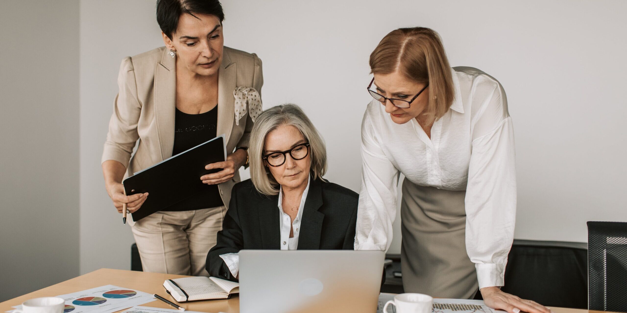 Three women working in the office.