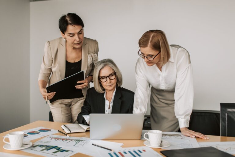 Three women working in the office.