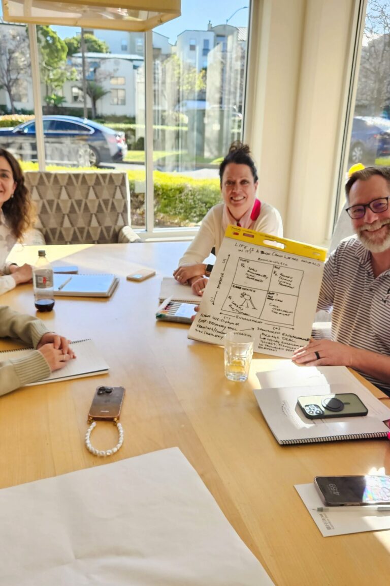 Seminar attendees cheerfully working on an activity together.