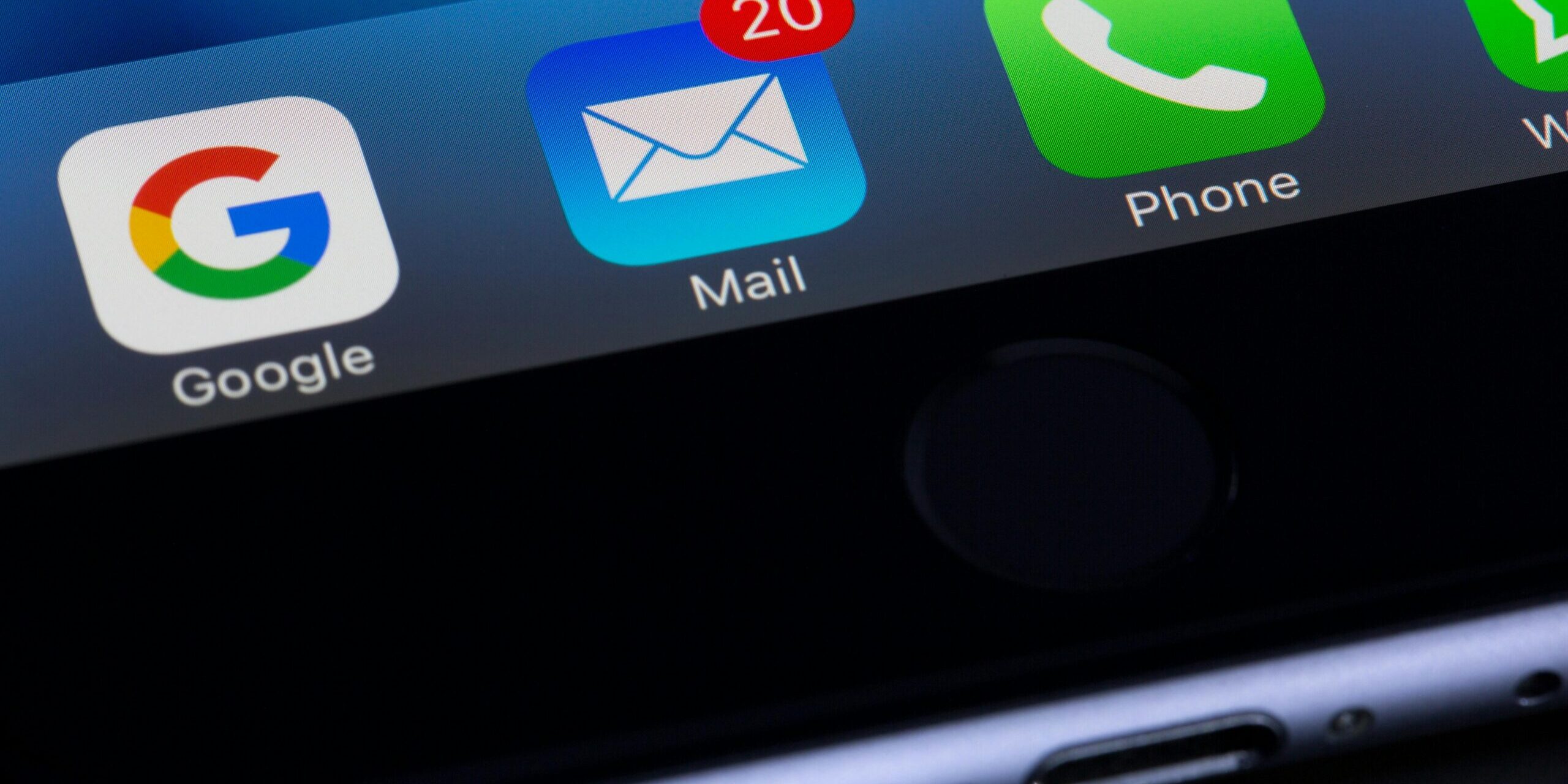 Photo of a phone mail app with a red dot on the top right corner notifying of 20 unread emails.