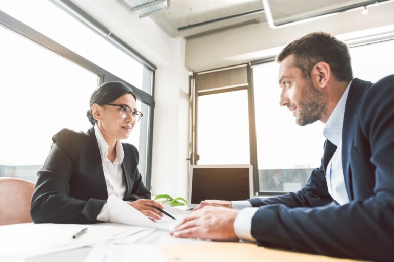 An executive coaching session with two professionals.