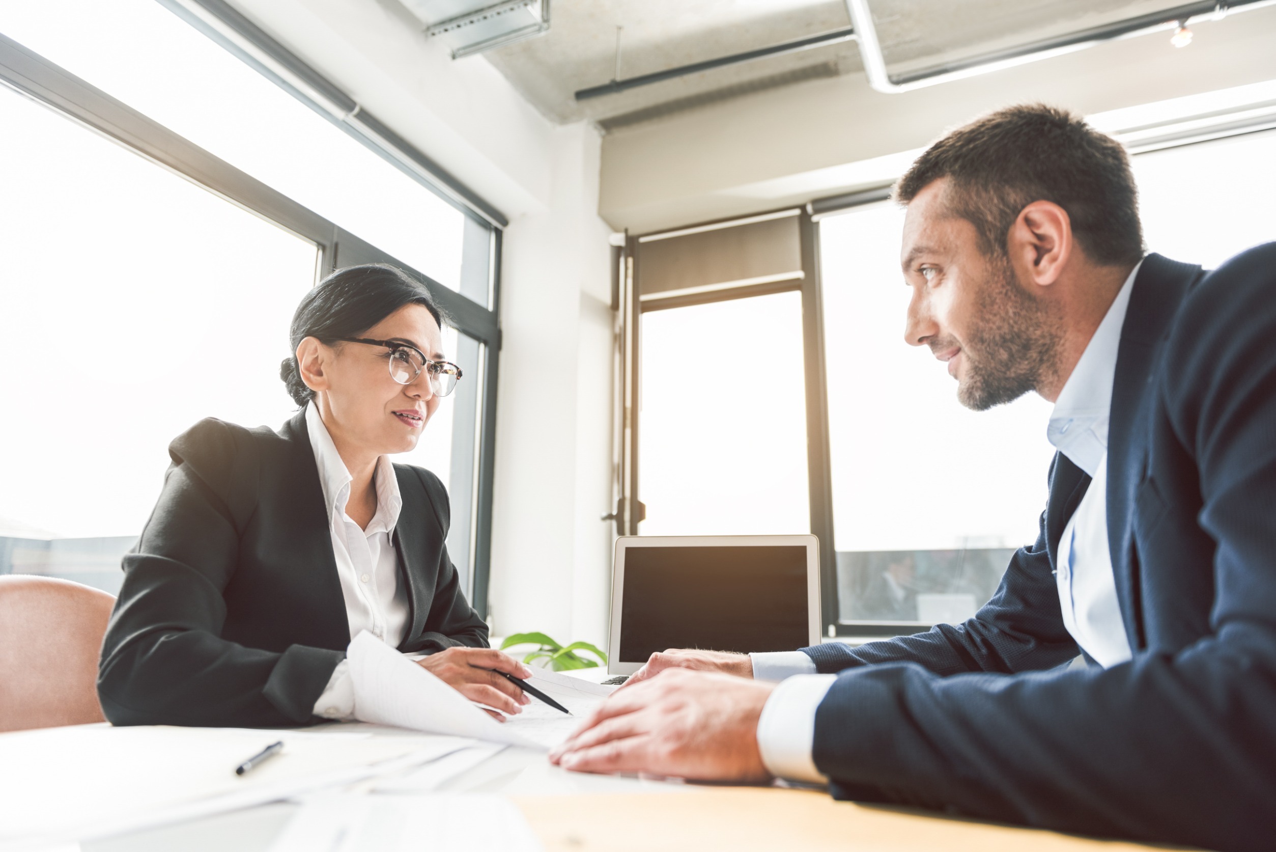 An executive coaching session with two professionals.