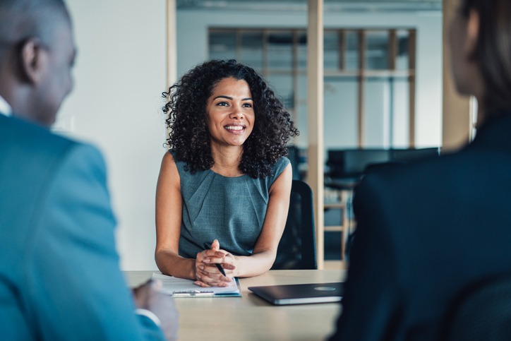 Three businesspeople in a meeting.