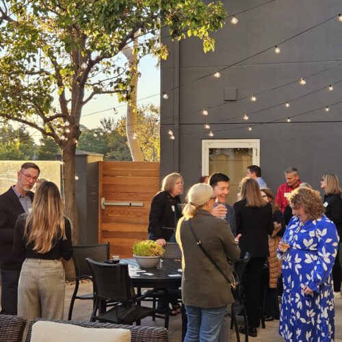 A wide shot of a seminar afterparty.