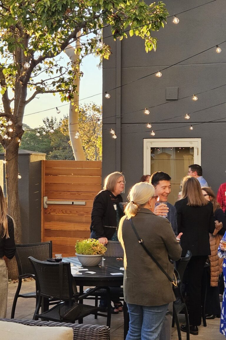 A wide shot of a seminar afterparty.