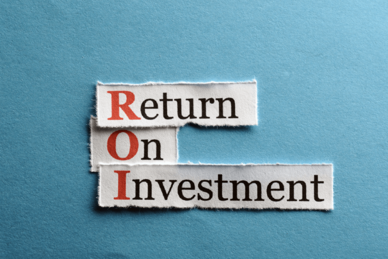 Three torn strips of paper on a blue background, assembled to say "Return On Investment." The first letter of each word is red, spelling "ROI."