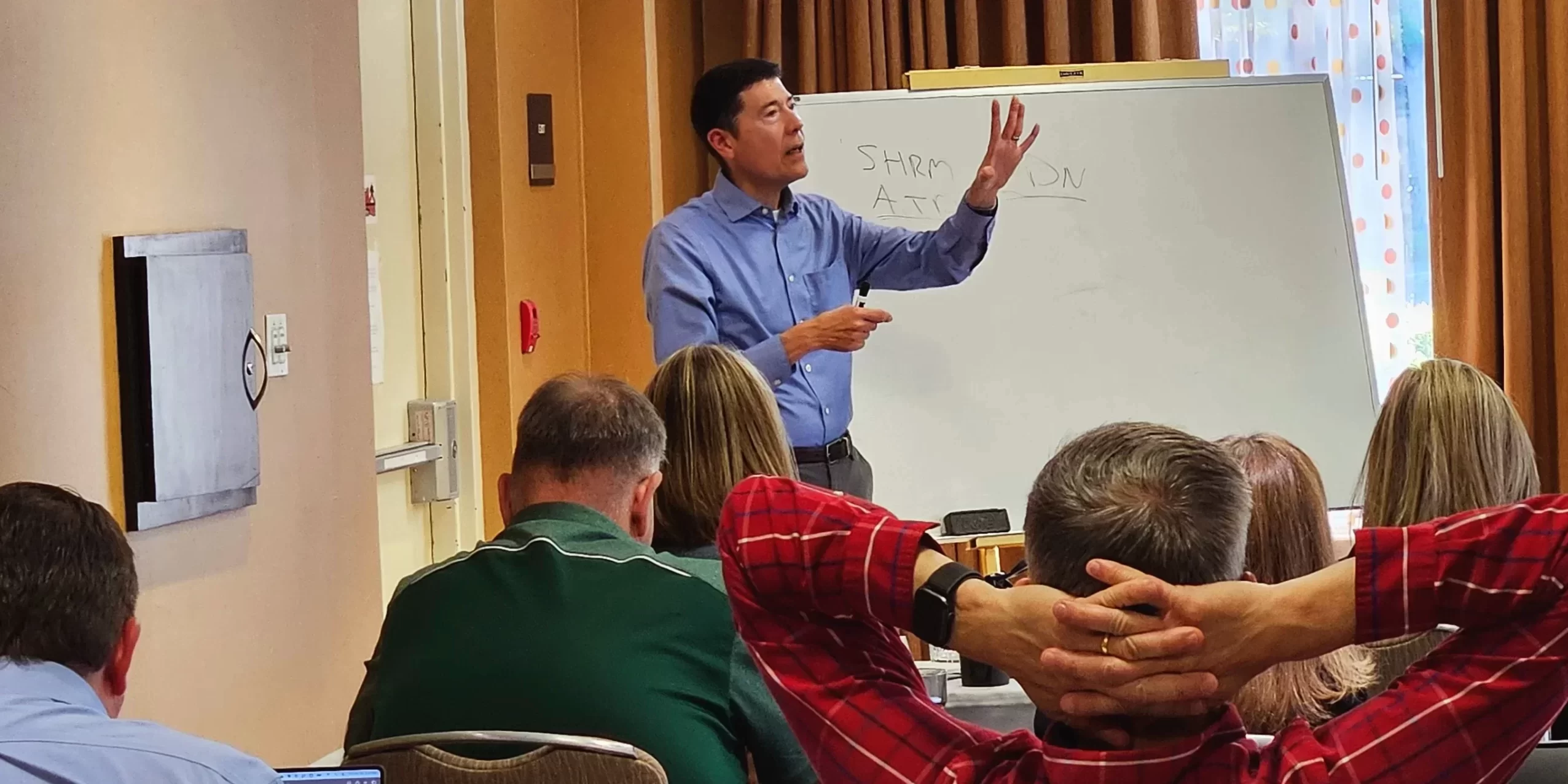 Michael Neuendorff speaking during the CEC in-person seminar