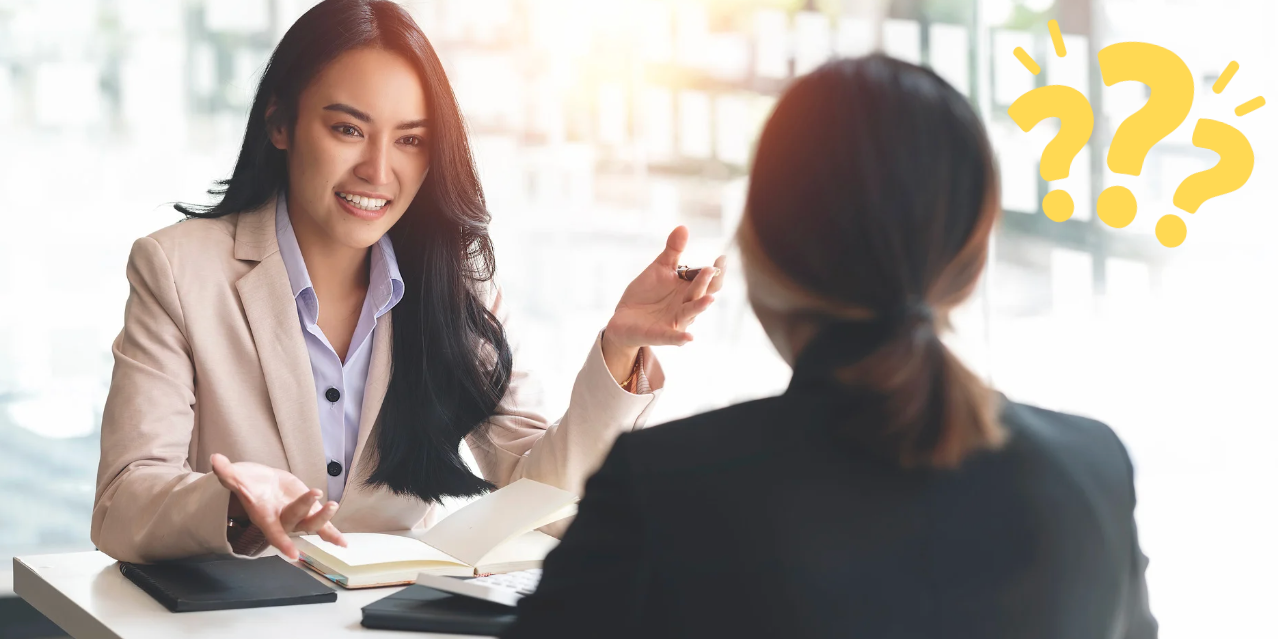Photo of two women talking to each other.