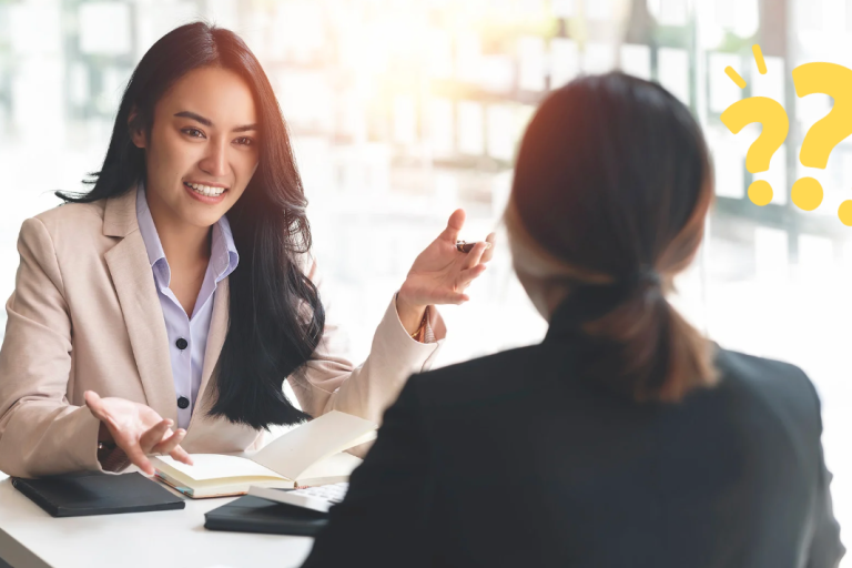 Photo of two women talking to each other.
