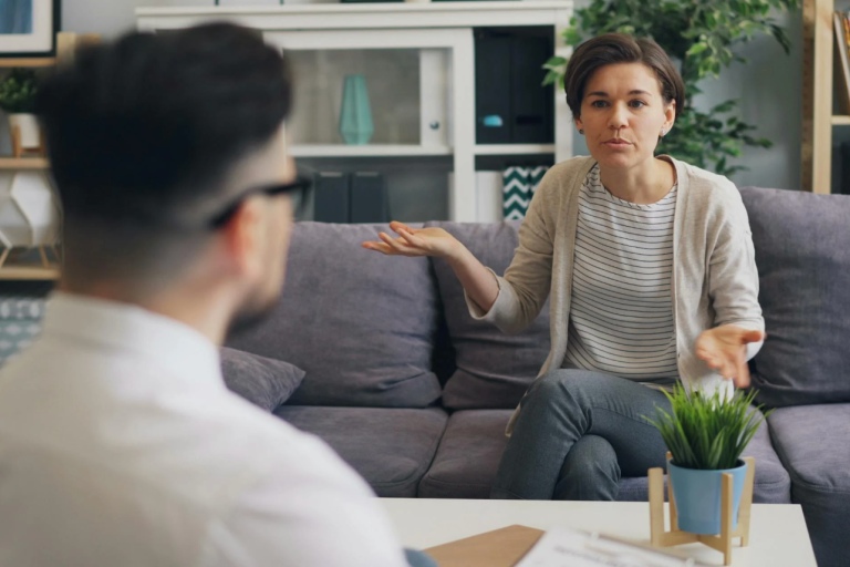 A therapist listening intently to a client.